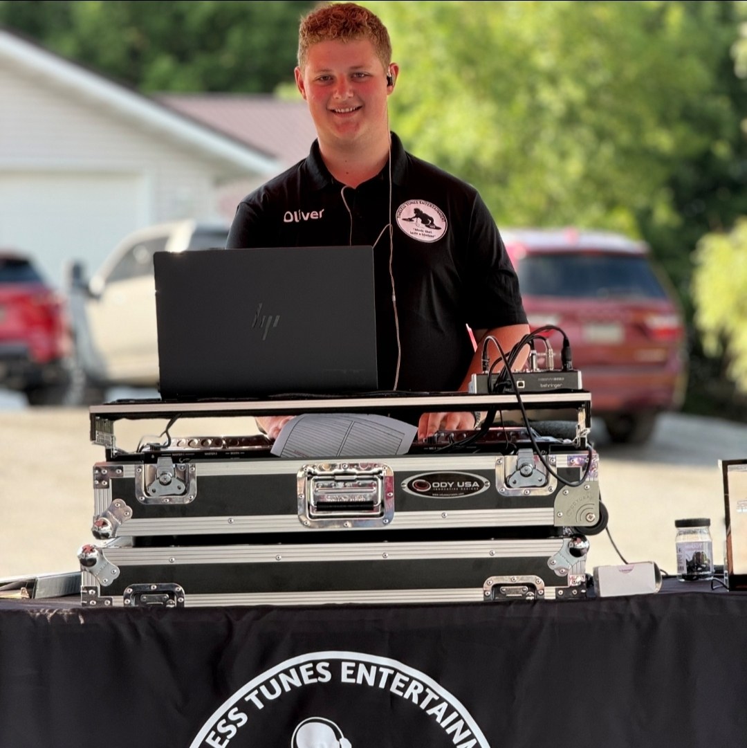 Oliver of Timeless Tunes Entertainment DJing at an outdoor event